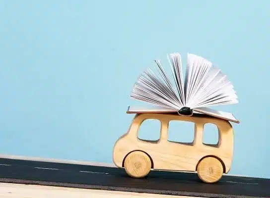 children's education. children's bus carrying a book