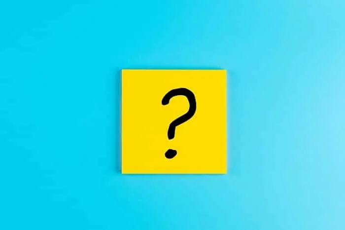 questions mark ( ? ) word in paper note on blue background. faq(