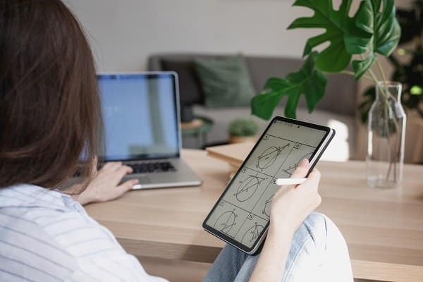 young beautiful woman student with digital tablet and laptop stu