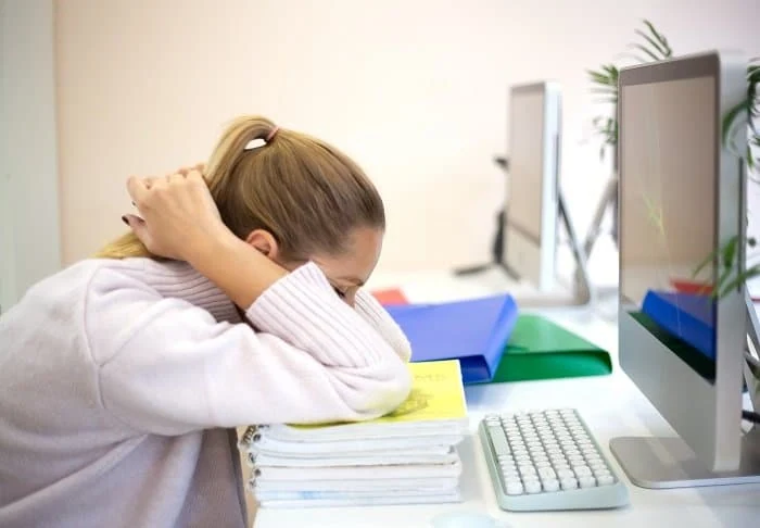 young woman is sad at the workplace. office work concep