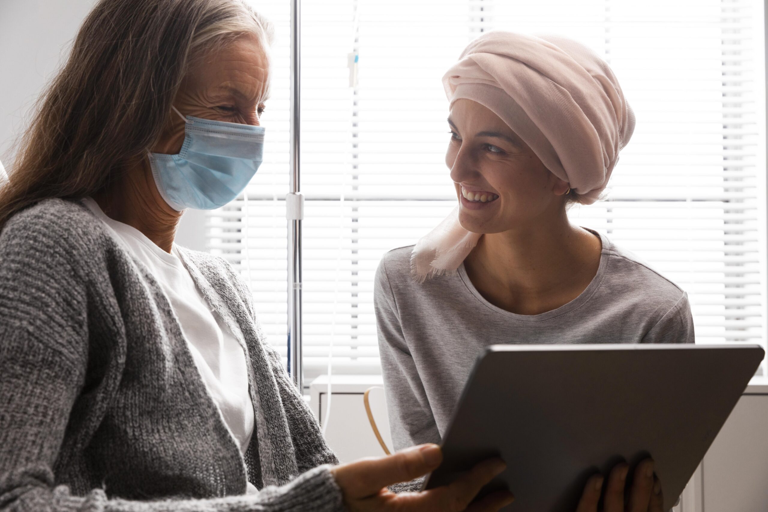 female patients talking hospital indoors